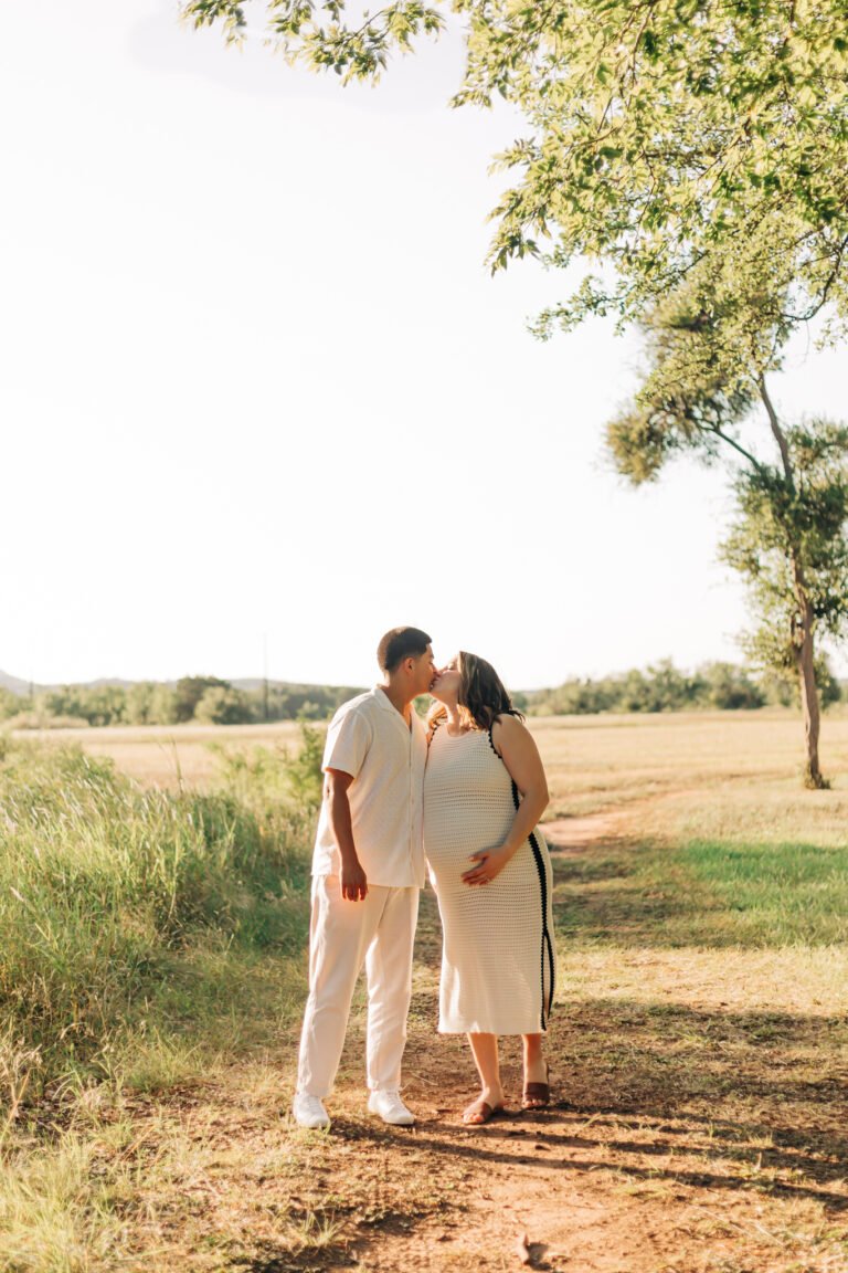 Couple kissing in Buffalo Gap field
