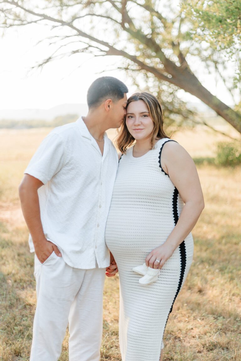 Couple poses in Buffalo Gap, Tx field