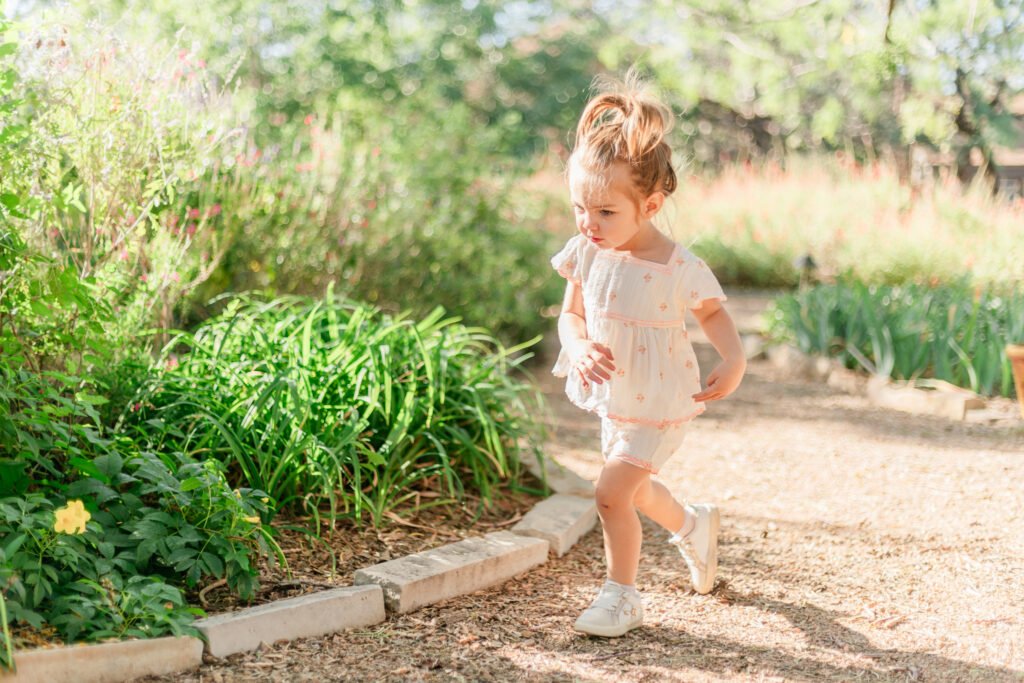 Small child running around the Swenson House photo session