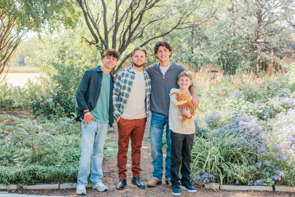 Boy holding cat during Abilene family photo session
