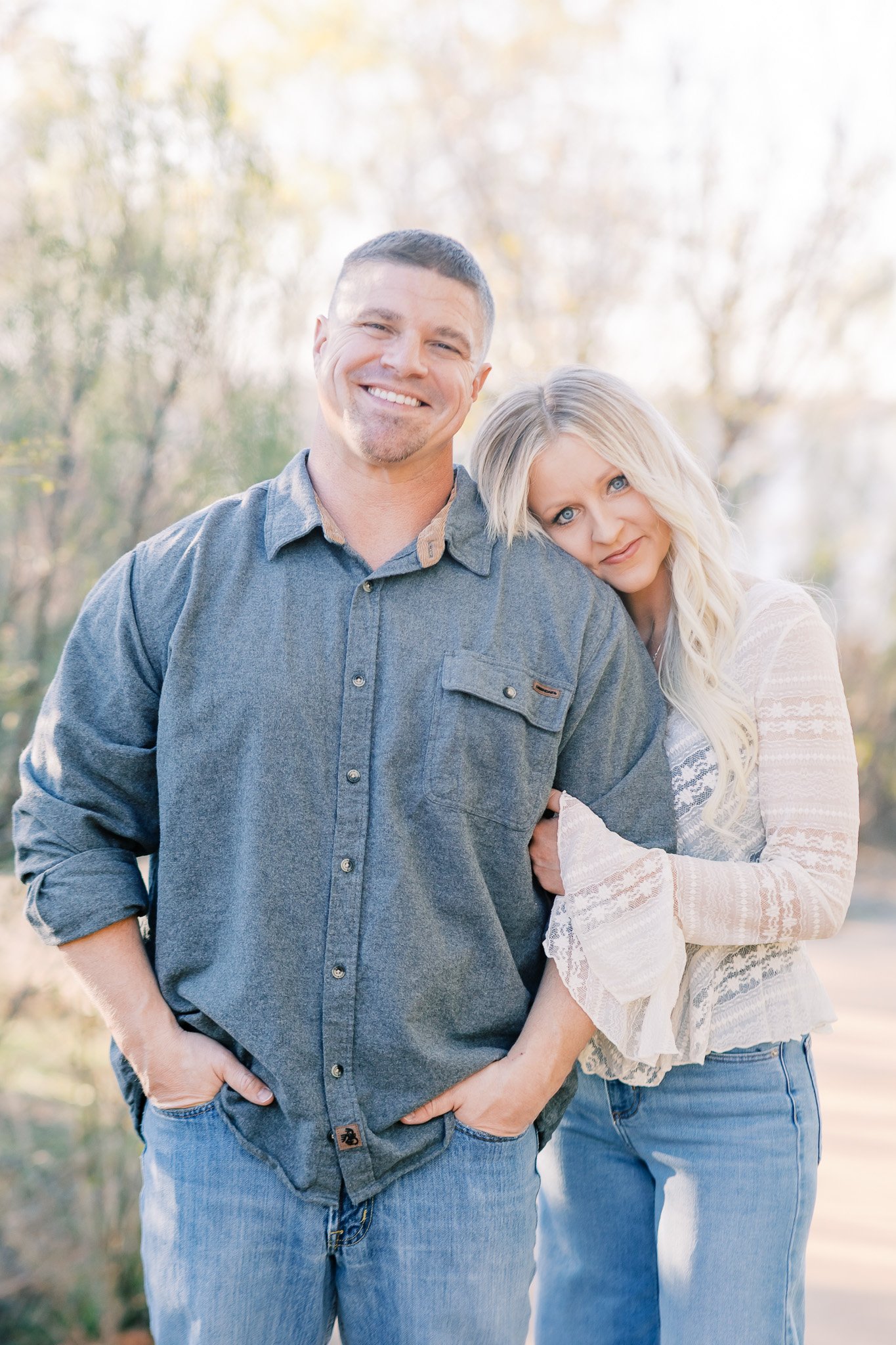 Couple posing together in front of Abilene photographer